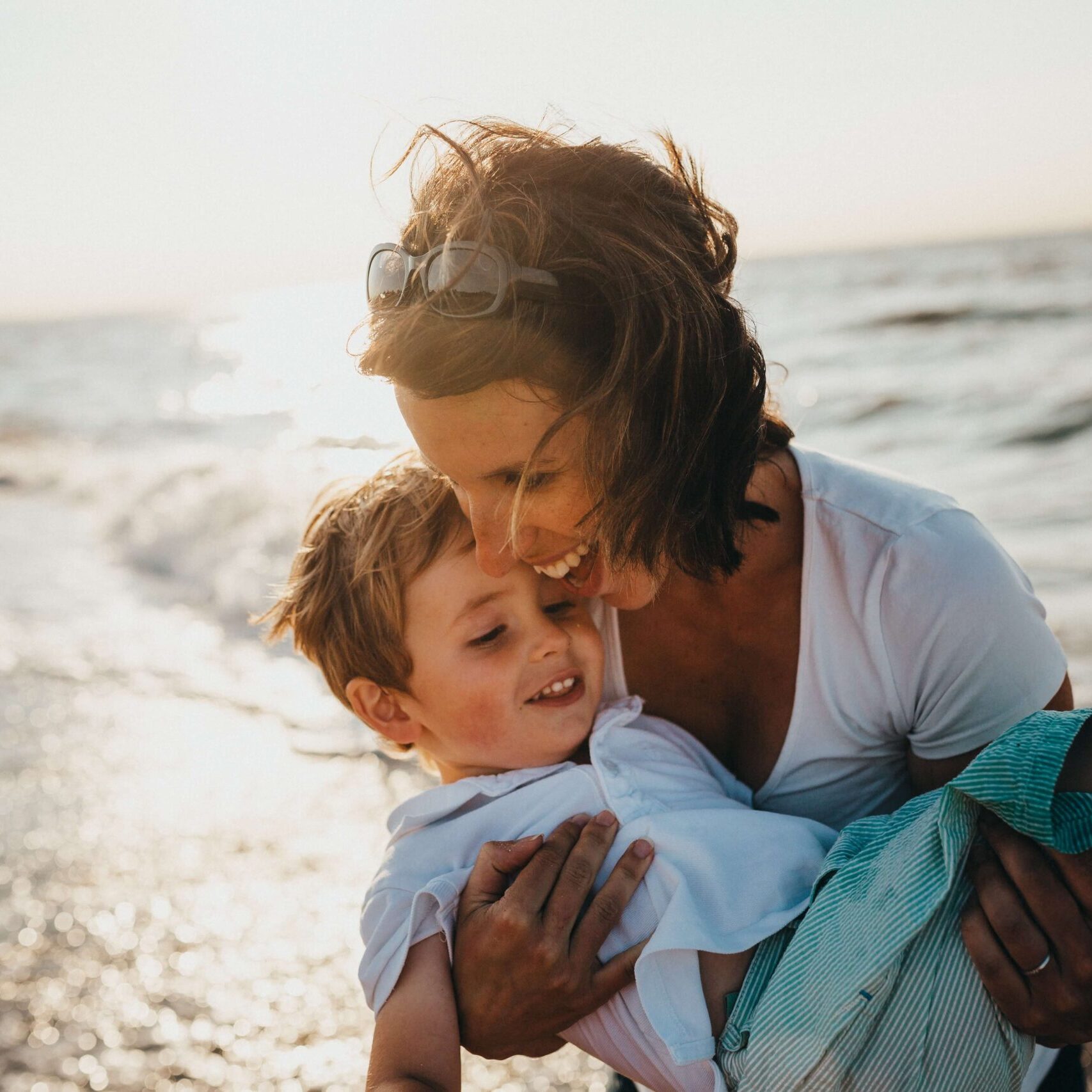 Mom with son on beach